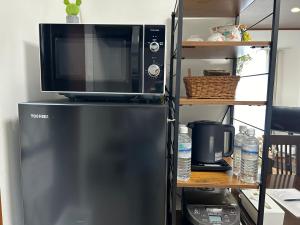 Una cocina o zona de cocina en 近藤沢駅の新装リノベーション一軒家 3LDK、無料駐車場完備、最大7名様までご利用可能