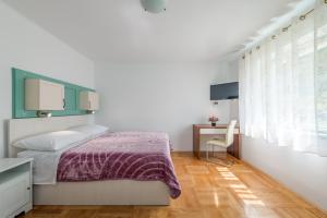 Posteľ alebo postele v izbe v ubytovaní Lady