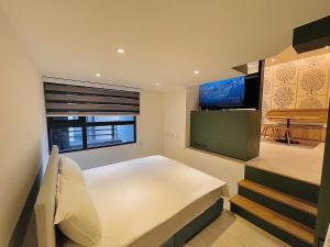 Giường trong phòng chung tại 礁溪楓禾Maple