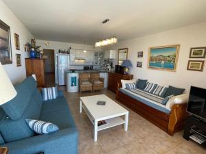 a living room with a couch and a table at Appartement Vieux-Boucau-les-Bains, 2 pièces, 5 personnes - FR-1-379-38 in Vieux-Boucau-les-Bains