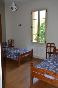 Postel nebo postele na pokoji v ubytování Gîte Le Petit Rouyot 3*