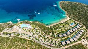an aerial view of a resort near the ocean at Kempinski Hotel Barbaros Bay Bodrum in Yaliciftlik