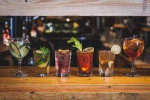 a group of different types of drinks on a table at Dairyman's Cottage At Tapnell Farm in Yarmouth