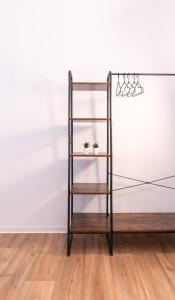 a shelf with two plants on it in a room at Barrierefrei I free parking I Terasse I Netflix in Quedlinburg