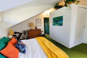 a bedroom with a bed with a yellow blanket on it at Homestay in Tuscan countryside with private bathroom and terrace in Borselli