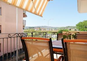 a balcony with chairs and a table and a view at Holihome_C&C Sunrise House in Tortoreto Lido