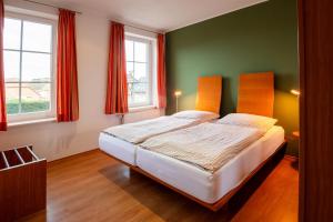 Letto o letti in una camera di Glockenhof Studtmann