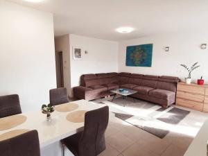 a living room with a couch and a table at Apartment Felix in Rijeka