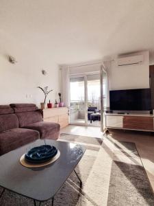 a living room with a couch and a table at Apartment Felix in Rijeka