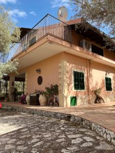 a house with a staircase on top of it at Villa Pantalica lato Sortino in Sortino +43 photos