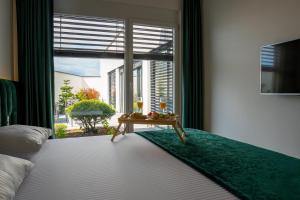 Postel nebo postele na pokoji v ubytování Vera HOTEL-VILLA + 37 fotografií