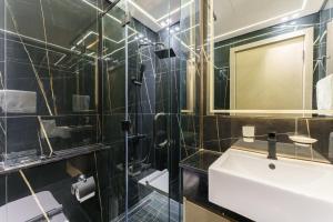 a bathroom with a sink and a mirror at Experience Serenity at Binghatti Crest in JVC in Dubai