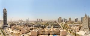 an aerial view of a city with tall buildings at Experience Serenity at Binghatti Crest in JVC in Dubai