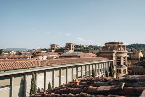 a view of a city from the roof of a building at La Croce d'Oro Santa Croce Suite Apartments in Florence