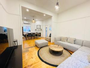 a living room with a couch and a table at D114 Victorian Central Stay in Melbourne
