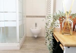 a bathroom with a sink and a toilet at HoliHome_Casa di Sara in Tortoreto Lido