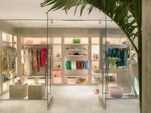 a display case in a clothing store with clothes at Grand Beach Hotel in Miami Beach