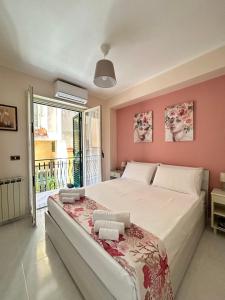 מיטה או מיטות בחדר ב-L'host in Taormina
