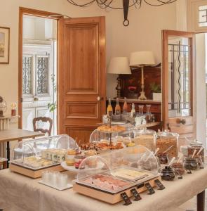 a buffet with many different types of food on a table at Hotel La Bienvenue in La Croix-Valmer +28 photos