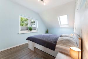 Ένα ή περισσότερα κρεβάτια σε δωμάτιο στο Feriendoppelhaus Sommer