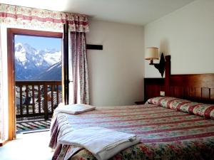 Postel nebo postele na pokoji v ubytování Hotel Locanda Grauson + 37 fotografií