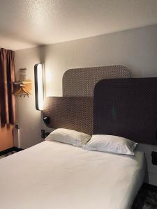 Lova arba lovos apgyvendinimo įstaigoje B&B HOTEL Montpellier Sud Lattes