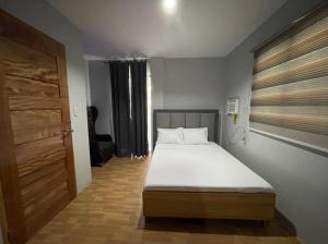 Postel nebo postele na pokoji v ubytování D Square Tagaytay