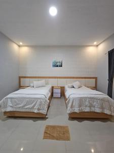 Ένα ή περισσότερα κρεβάτια σε δωμάτιο στο LOSMEN 88