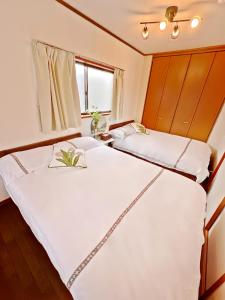 Postel nebo postele na pokoji v ubytování 古-雅の宿 + 34 fotografií