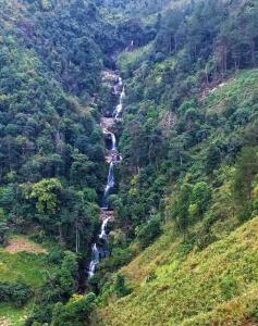 a view of a mountain with two waterfalls at Homestay Ngọc Thủy Điểm dừng chân lên Đồi Mâm Xôi in Mù Cang Chải
