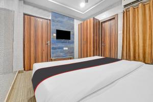 Ένα ή περισσότερα κρεβάτια σε δωμάτιο στο Collection O Mohan Paradise