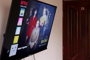 a flat screen tv hanging on a wall at Casanova Inn - Boutique Hotel in Dilijan