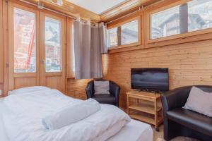 Voodi või voodid majutusasutuse Studio dans le plus beau village de Suisse toas