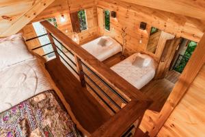 Postel nebo postele na pokoji v ubytování Tominejo Ecolodge - Casas en los árboles