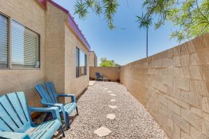 two blue chairs sitting next to a wall at Mesa Townhome with Community Perks Close to Golf! in Mesa