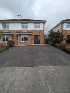 an empty driveway in front of a house at 4 Bed House, spacious & modern with parking Tubbercurry in Tobercurry
