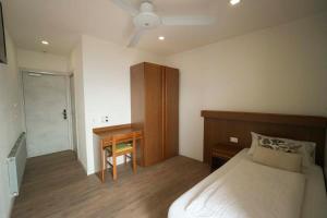 Ένα ή περισσότερα κρεβάτια σε δωμάτιο στο Albergo Deva