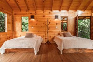 Postel nebo postele na pokoji v ubytování Tominejo Ecolodge - Casas en los árboles