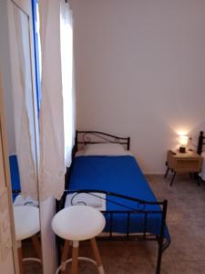Postel nebo postele na pokoji v ubytování Meltemi Rooms and Studios