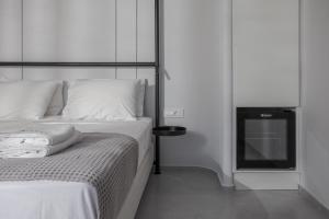 Posteľ alebo postele v izbe v ubytovaní Basilico Suites Adults Only by Estia