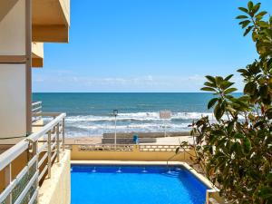 a swimming pool with a view of the ocean at Apartamento Gandia Bellreguard 3000 in Bellreguart