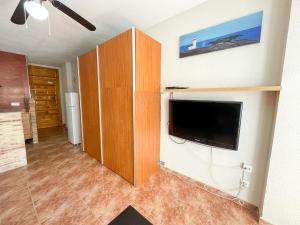 a living room with a flat screen tv on a wall at Apartamento Gandia Bellreguard 3000 in Bellreguart