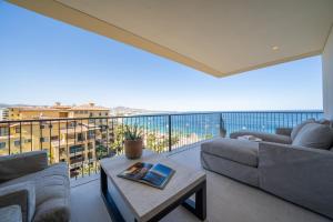 a living room with a couch and a table at 1 Homes Preview Cabo in Cabo San Lucas