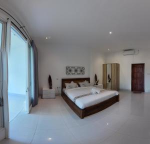 Voodi või voodid majutusasutuse Turtle House Lombok toas
