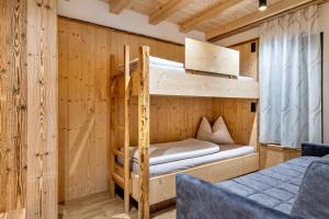 Voodi või voodid majutusasutuse Blosegghof Bergchalets Waldblick toas