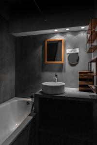 a bathroom with a sink and a bath tub at IMMODREAMS - La Tanière - Avoriaz in Avoriaz