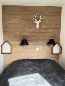 Ένα ή περισσότερα κρεβάτια σε δωμάτιο στο IMMODREAMS - Le Caribou - Avoriaz