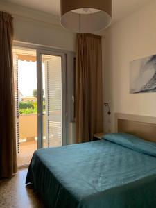 Postel nebo postele na pokoji v ubytování Hotel Maria