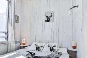 Postel nebo postele na pokoji v ubytování IMMODREAMS - Le Pas du Lac - Avoriaz