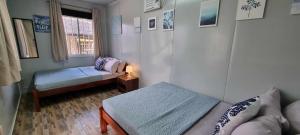 Postel nebo postele na pokoji v ubytování Olive Hostel Roxas City